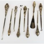 A group of eight Victorian silver handled button hooks, longest 24cm. together with a silver handled