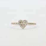 An 18ct white gold heart ring set with brilliant cut diamonds and diamond set shoulders, approx. 0.