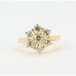 An 18ct yellow gold daisy cluster ring set with large brilliant cut diamonds, approx. 2.30ct