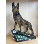 An art deco pottery figure of a German shepherd dog, H. 47cm.