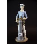 A large Lladro porcelain figurine of a young sailor, H. 33cm. (A/F).