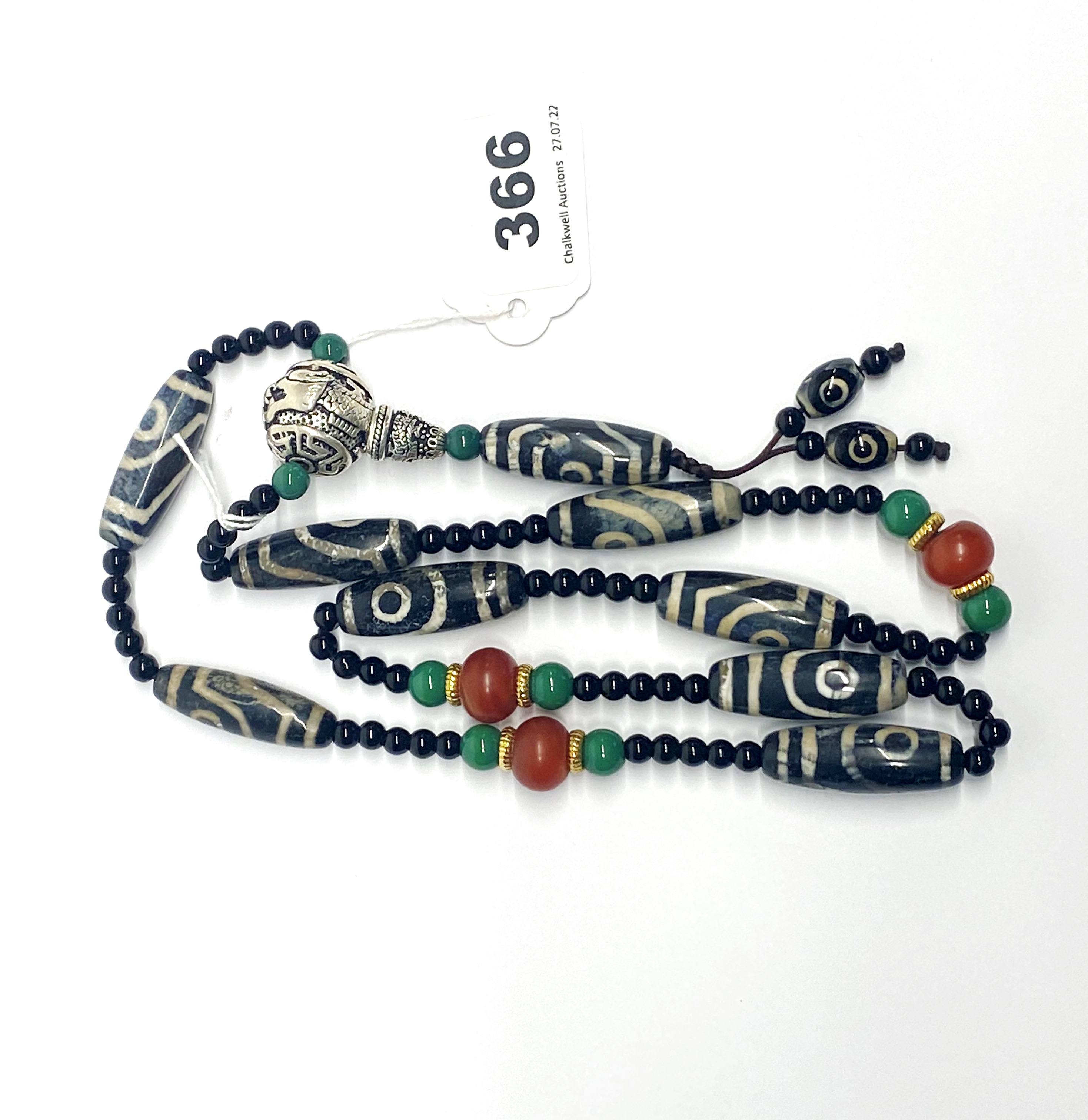 A Tibetan dzi bead prayer necklace, folded L. 50cm.