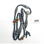 A Tibetan dzi bead prayer necklace, folded L. 50cm.