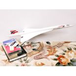 A travel agents display model of Concorde, L. 63cm. Together with other Concorde memorabilia.