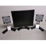 A Dell desktop screen model no. 1708FPt together with two extra stands.