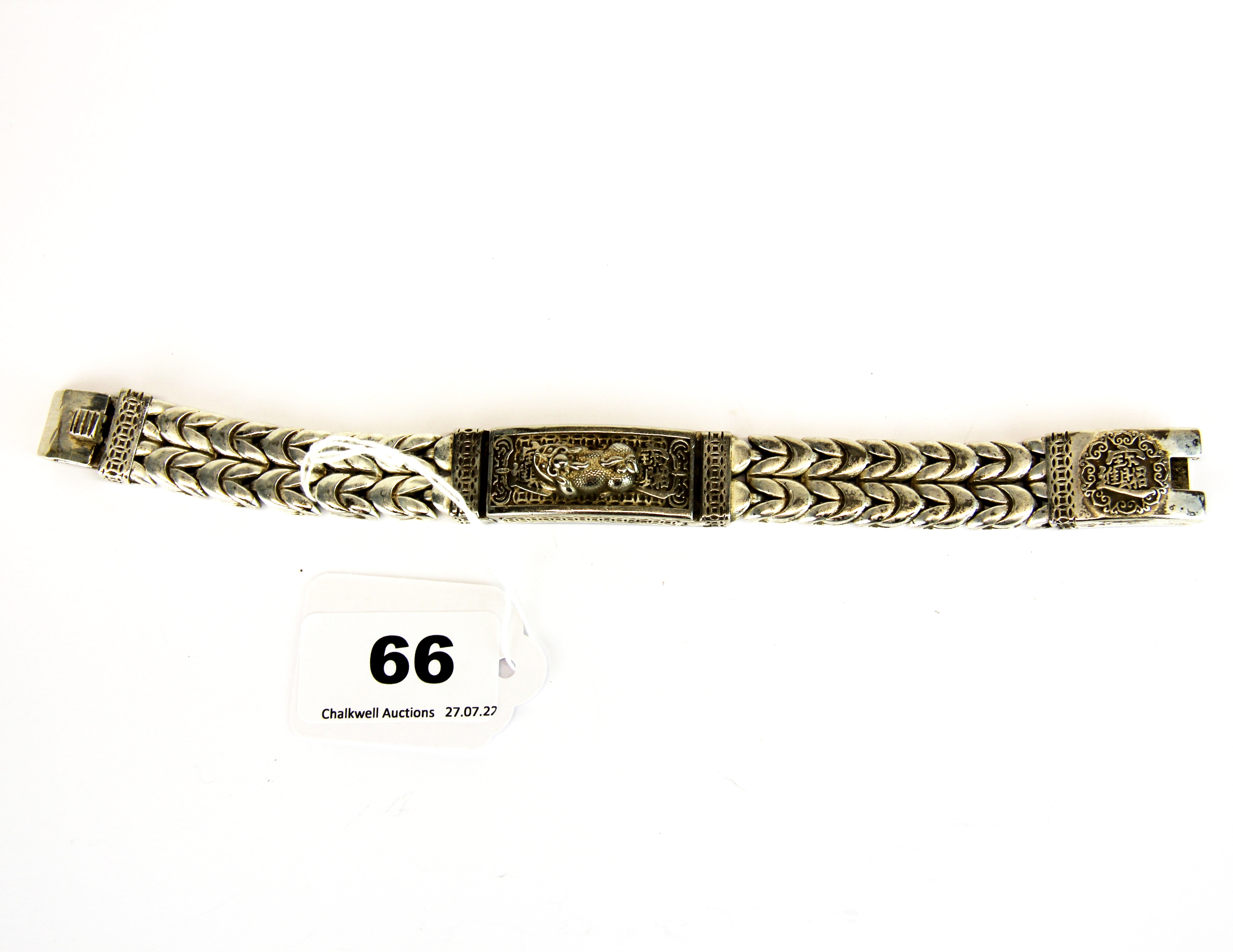 A heavy Chinese white metal mans bracelet featuring a lion dog, W. 1.5cm. Bracelet L. 21cm. - Image 2 of 3