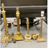 Four vintage brass column table lamps, tallest 53cm.