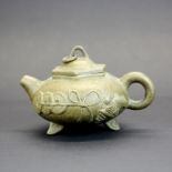 An unusual Chinese Yixing terracotta teapot, W. 13cm. H. 8cm.