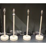 A set of four contemporary suede leather and chrome table lamp bases, H, 46cm.