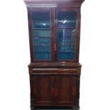 A 19th century flame mahogany veneered bookcase over cabinet, W. 91cm, H. 196cm.