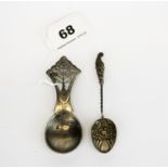 An Art Nouveau hallmarked silver caddy spoon, L. 10cm. Together with a further hallmark silver tea