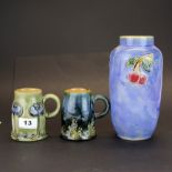 Two Royal Doulton Art Nouveau stoneware beakers, H. 10cm. Together with Royal Doulton stoneware