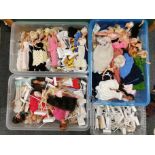 A large quantity of Sindy and other dolls with stands.