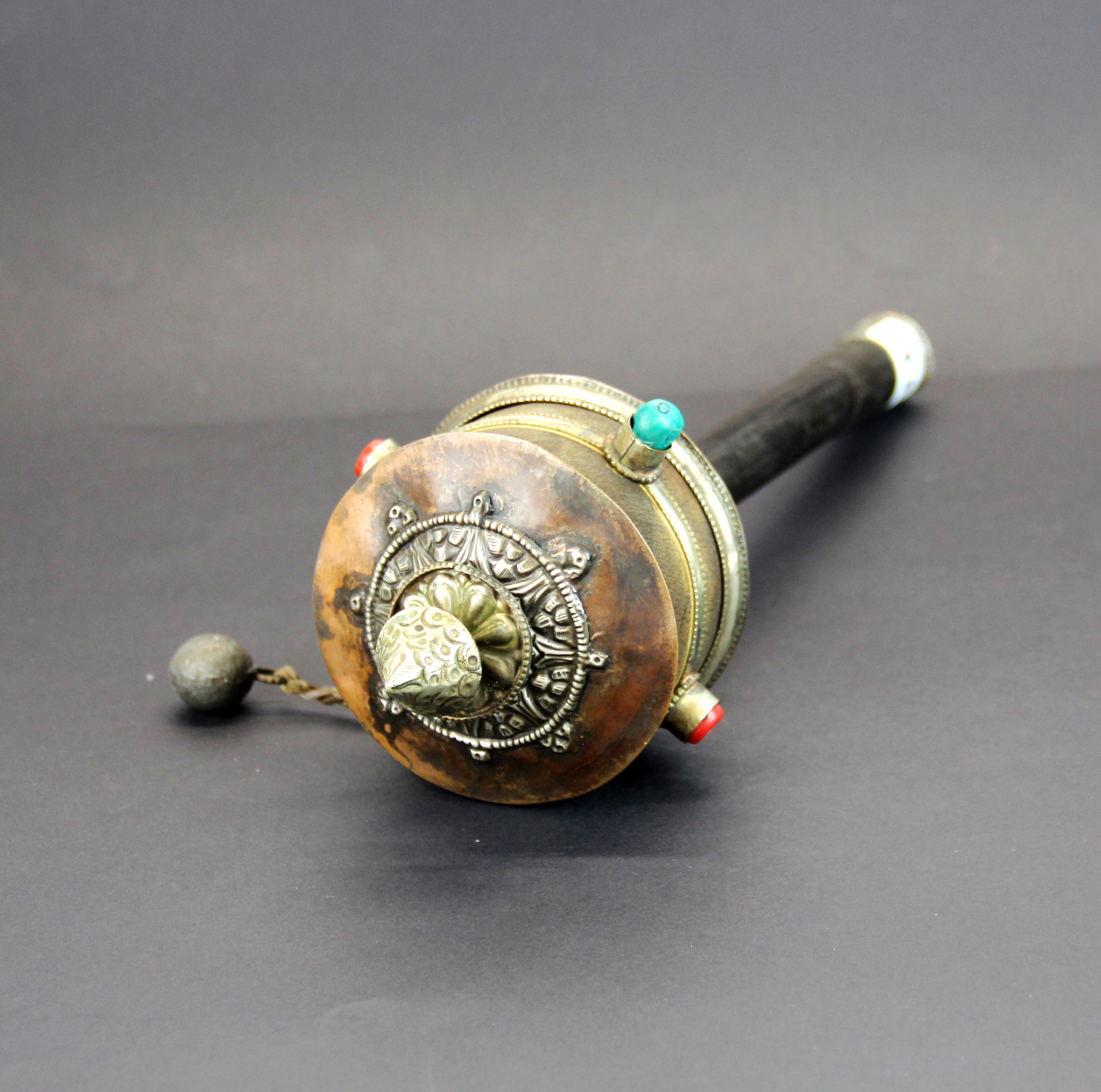 A Tibetan prayer wheel, H. 34cm. - Image 2 of 3