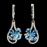 A pair of 925 silver flower shaped drop earrings set with oval cut blue topaz and white stones, L.