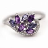 A 925 silver ring set with marquise cut amethysts, iolites and white stones, (N).