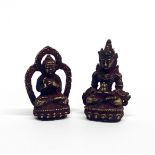 Two Tibetan miniature figures of the seated Buddha, H. 5cm.