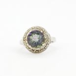 A 925 silver ring set with a large round cut mystic topaz and diamonds, (O).