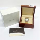 An Officina del Tempo wristwatch with diamond set bezel.
