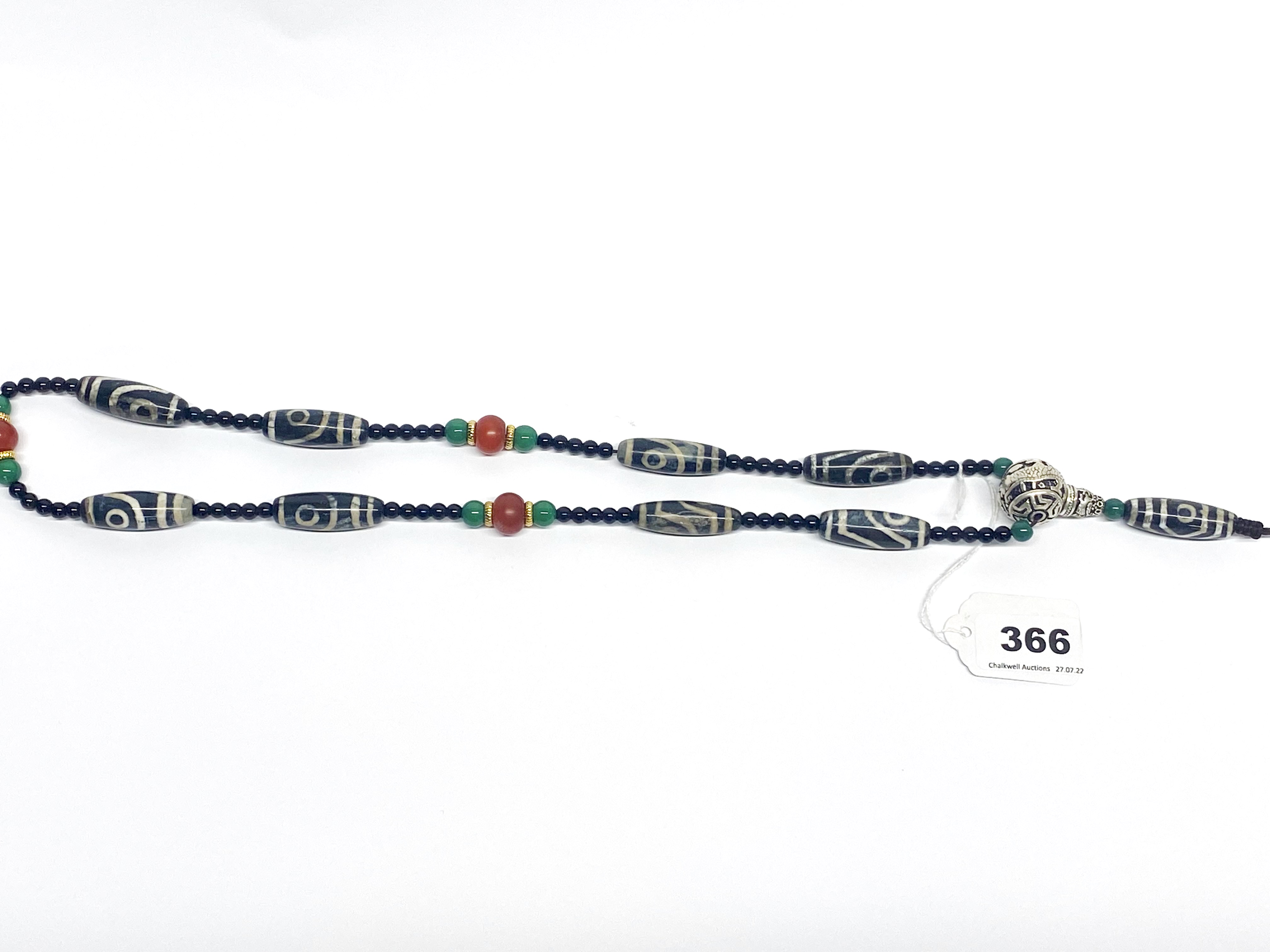 A Tibetan dzi bead prayer necklace, folded L. 50cm. - Image 2 of 2