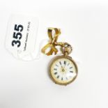 An antique lady's 14ct gold cased fob watch on a 9ct gold brooch fob, watch Dia. 3cm.