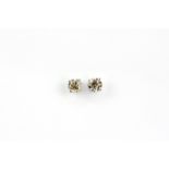 A pair of 18ct white gold diamond stud earrings each set with a large brilliant cut diamond, approx.