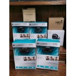 A group of seven webcams including Logitech.