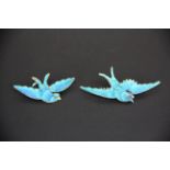 A fine early 20th century pair of Chinese white metal and Kingfisher feather bird brooches with