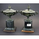 A pair of 19th century French slate and bronze urn garnitures and covers, H. 26cm.