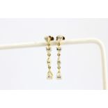 A pair of 18ct yellow gold drop earrings set with pear and marquise cut diamonds, approx. 1.44ct