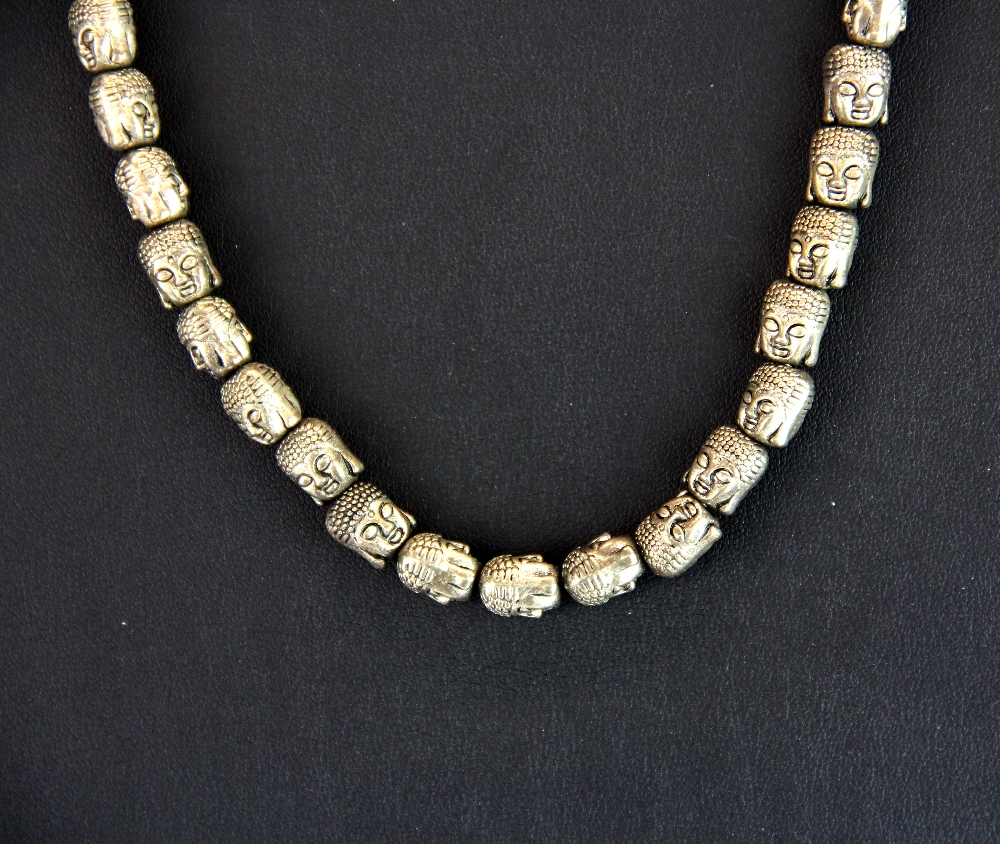 A Tibetan steel prayer necklace of Buddha head beads threaded on a steel cord, necklace L. 48cm. - Image 2 of 2