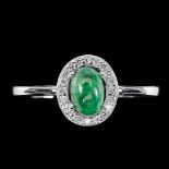 A 925 silver cluster ring set with cabochon cut emerald, (O.5).