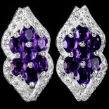 A pair of 925 silver earrings set with oval cut amethysts and white stones, L. 2.1cm.