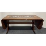 A 1970's Scandinavian hardwood drop leaf dining table inset with ceramic tiles, closed L. 170cm