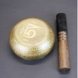A Tibetan bronze singing bowl with wooden hammer, Dia. 12.5cm.