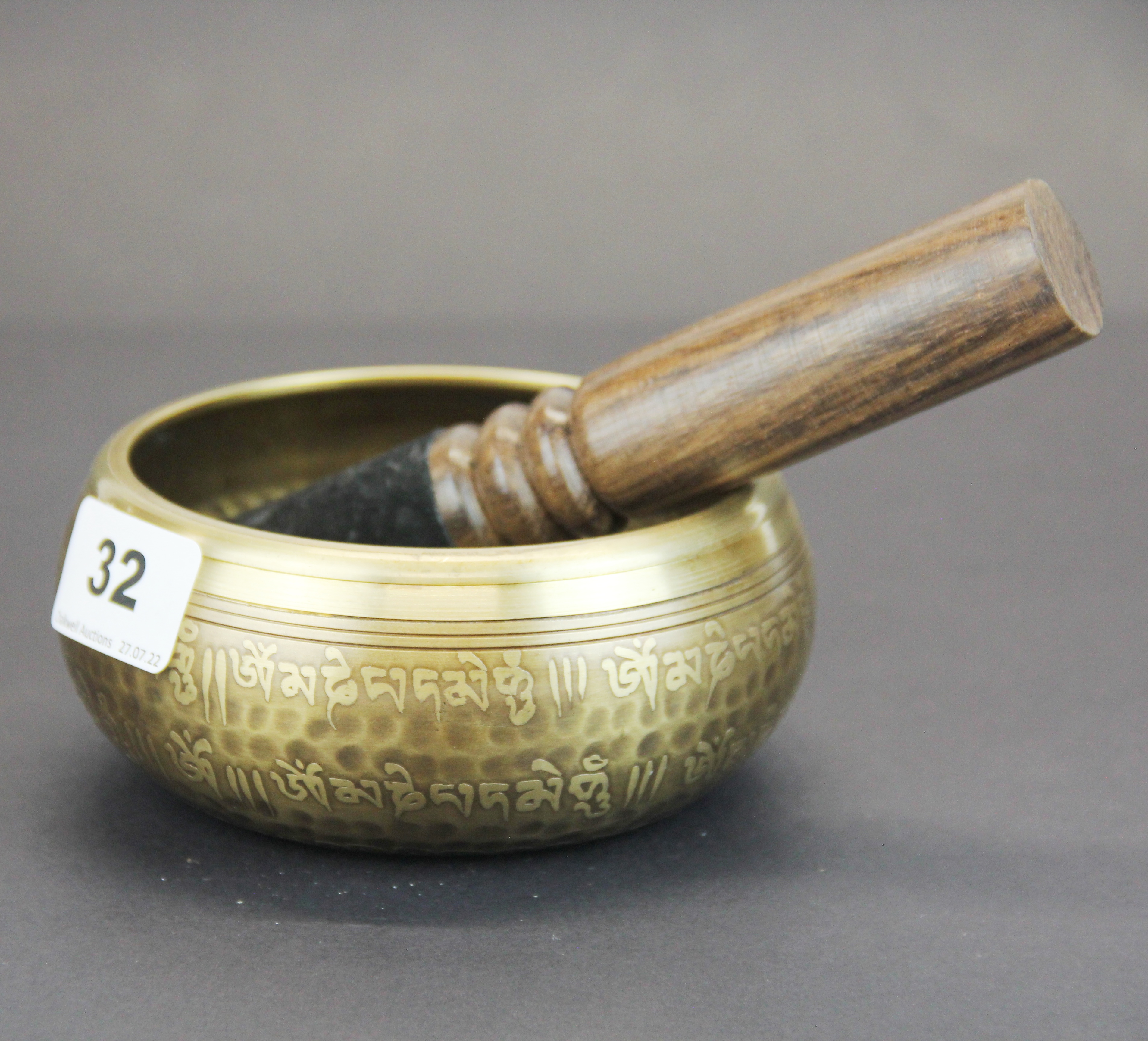 A Tibetan bronze singing bowl with wooden hammer, Dia. 12.5cm. - Image 3 of 3