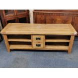 A heavy quality light oak coffee table with two drawers. W. 154 x 50 x 56cm.