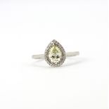 An 18ct white gold ring set with a pear cut diamond, approx. 0.75ct, surrounded by brilliant cut