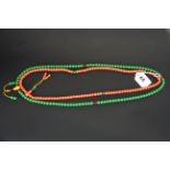 Two strands of Tibetan glass prayer beads imitating coral and jade, longest closed L. 50cm.