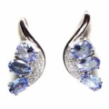 A pair of 925 silver earrings set with oval cut tanzanites and white stones, L. 1.8cm.