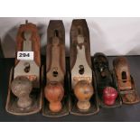 A group of Stanley and other woodworking planes.