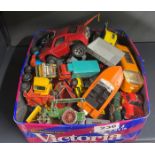 A box of mixed die cast model vehicles.