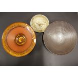 Two large studio pottery bowls, largest Dia. 41cm. together with a studio pottery dish, Dia. 25cm.