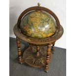 A vintage globe drinks trolley (no hinge mechanism or fitting for lid) H. 94cm.