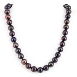 A large black cultured pearl necklace with a white metal clasp, approx. L. 42cm.