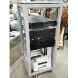 A rackmount shelving unit together with three rackmount cases.