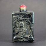A Chinese carved horn snuff bottle with gilt metal and hardstone stopper, H. 8.5cm.