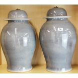 A pair of large Chinese grey glazed porcelain jars and lids, H. 50cm.