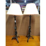 A pair of wrought iron table lamps shades, H. 75cm.