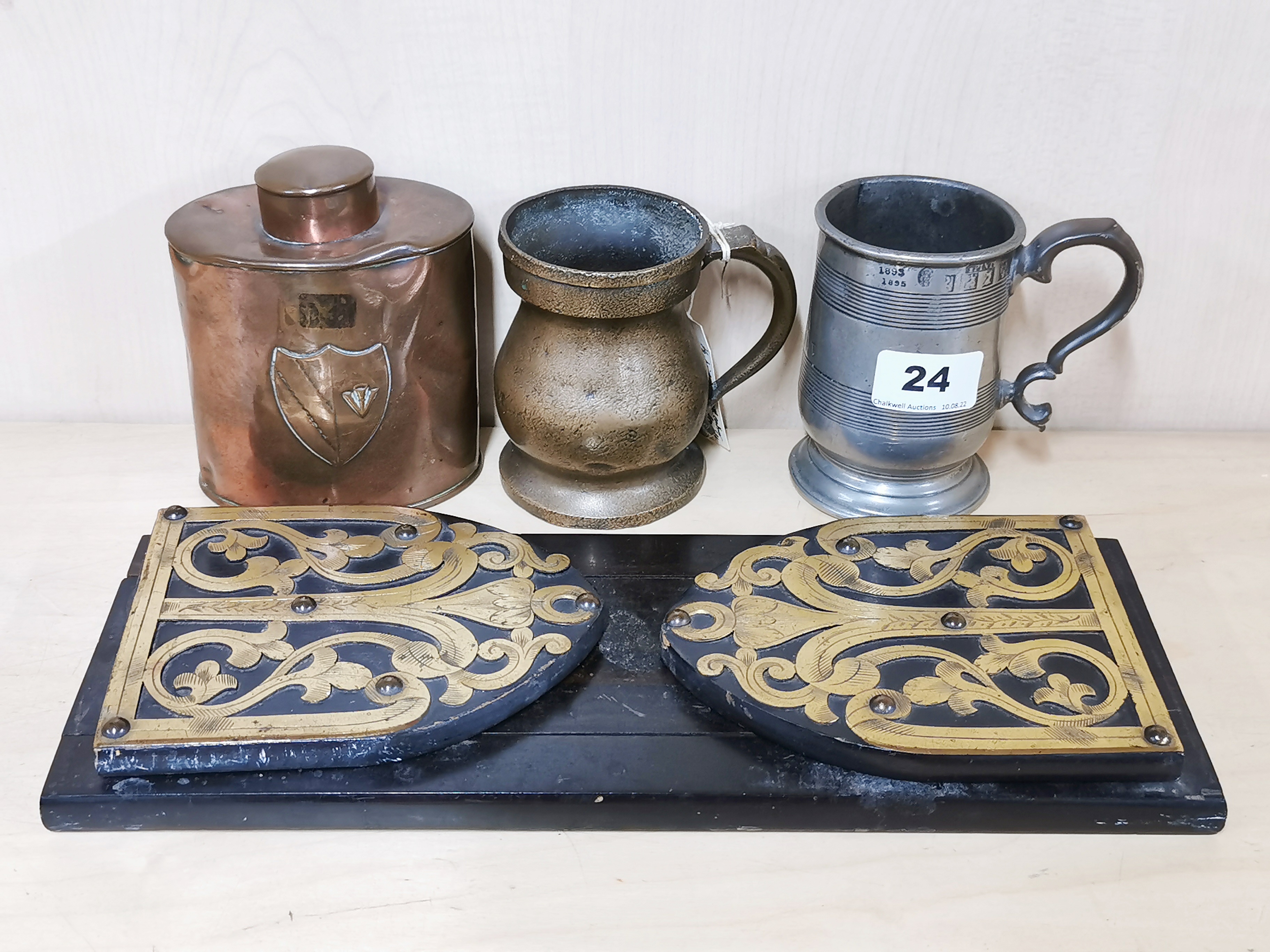 A 19th century bronze half pint measure, together with a half pint pewter tankard a hammered